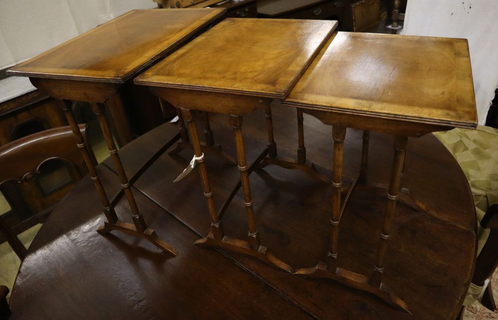 Three rectangular walnut occasional tables (formerly a nest of tables), largest width 50cm, depth 34cm, height 56cm